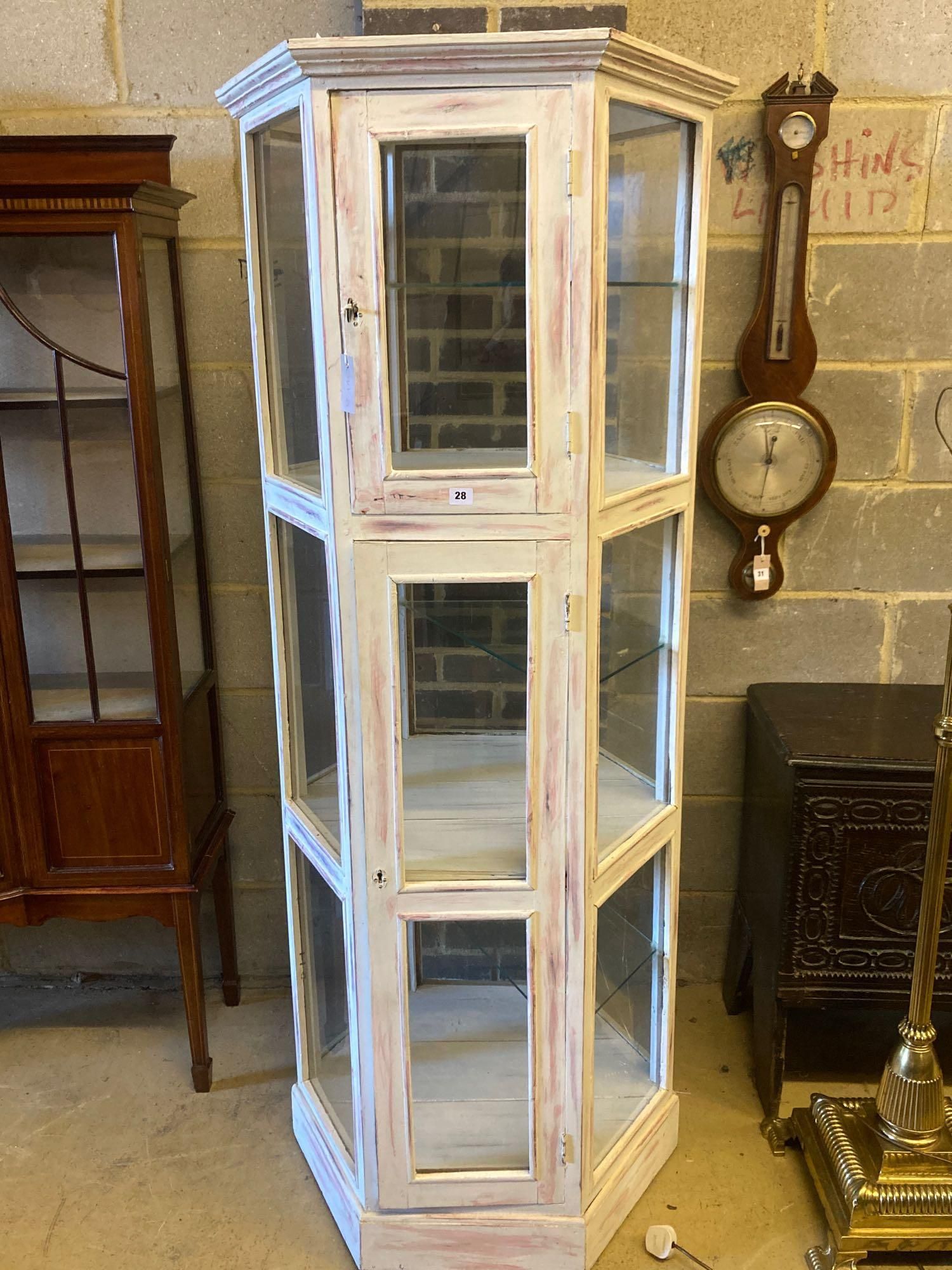 A modern white and pink marble effect painted display case, width 76cm height 181cm